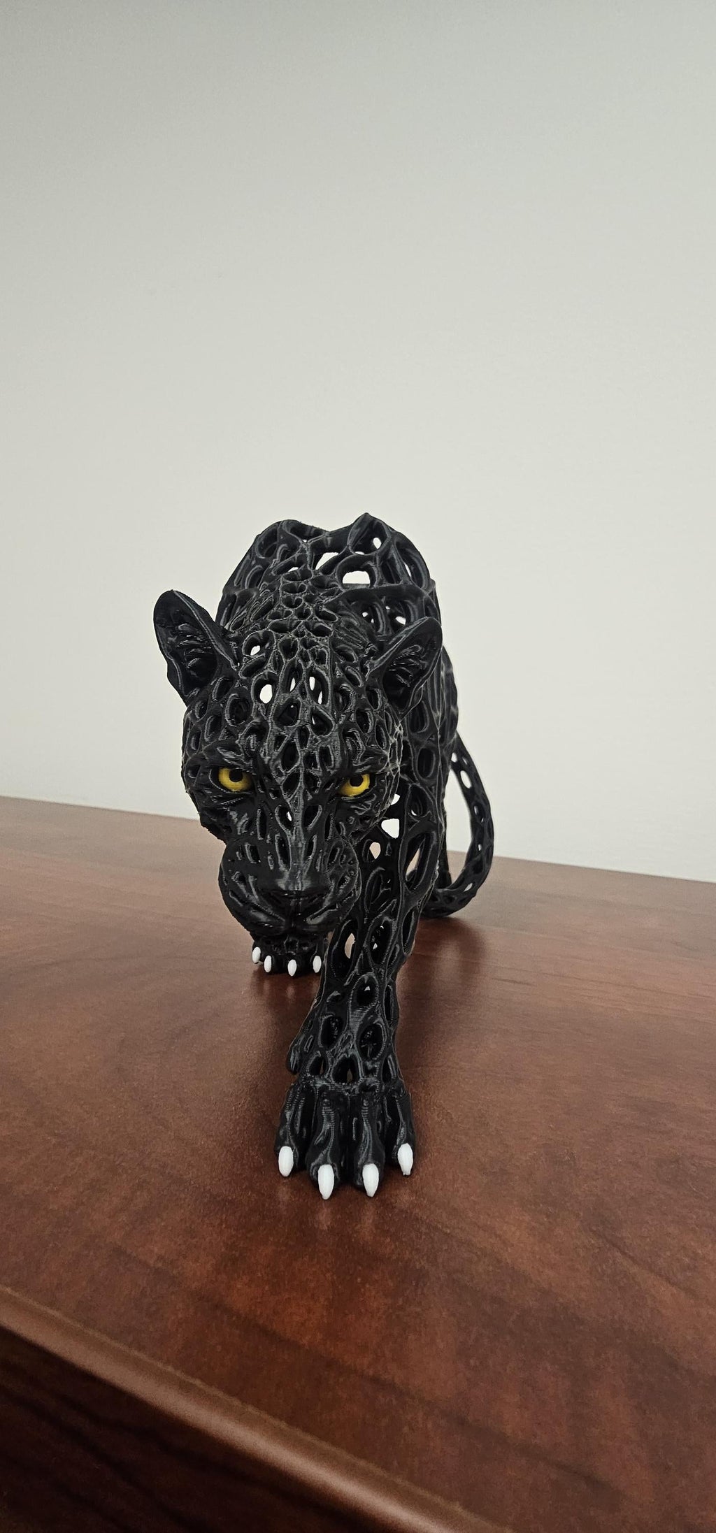3D printed black voronoi panther sculpture front facing