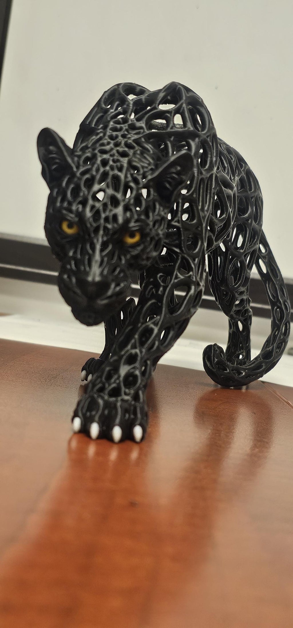 3D printed black voronoi panther sculpture front view